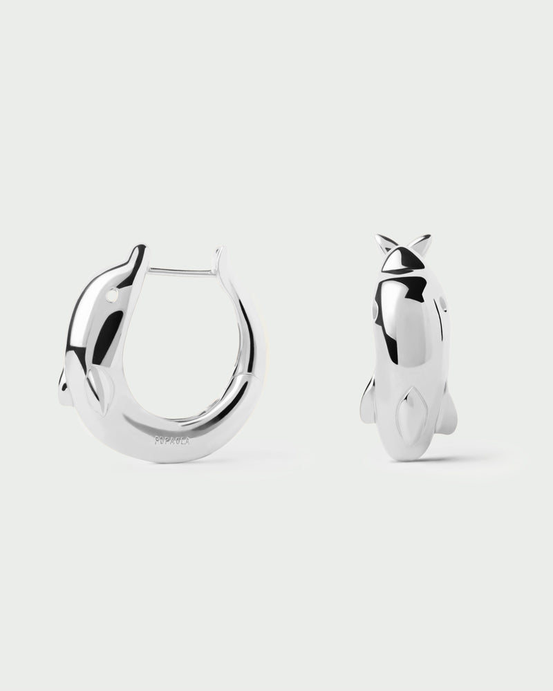 Silver modern dolphin hoops with a sculptural shape