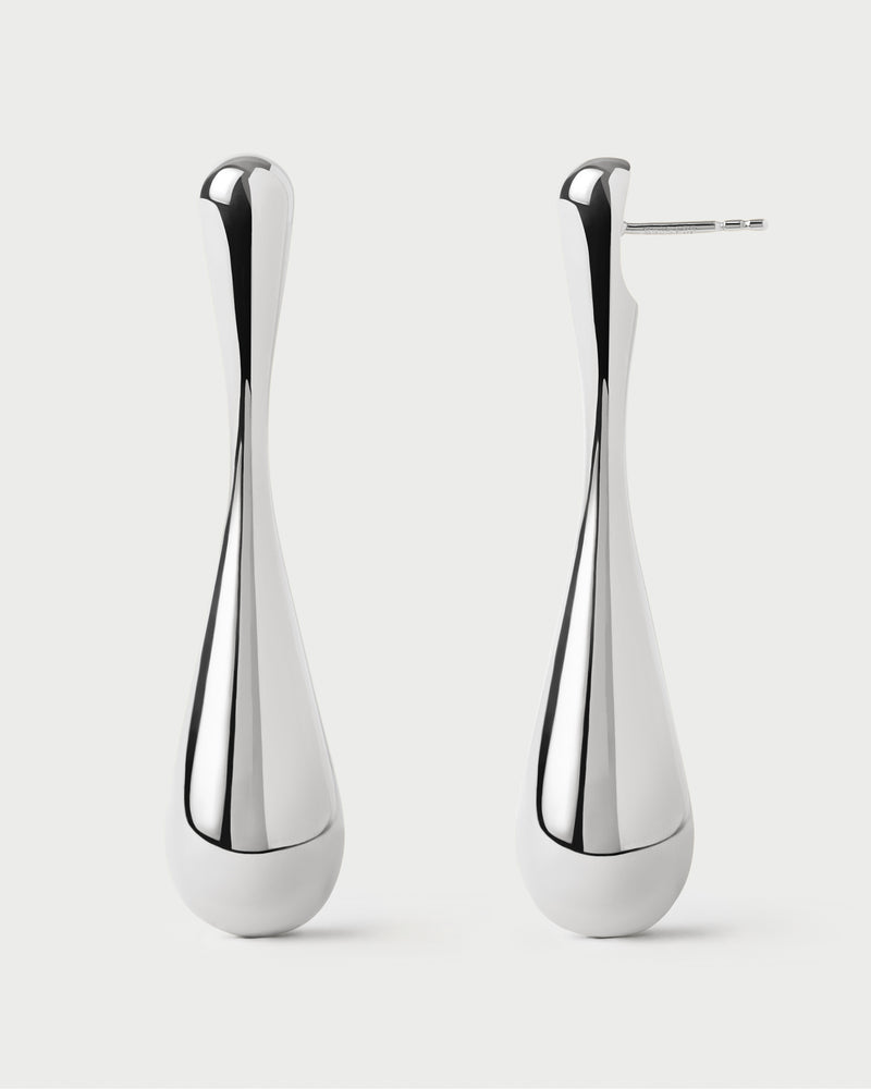 Elegant long drop silver earrings with sculptural design