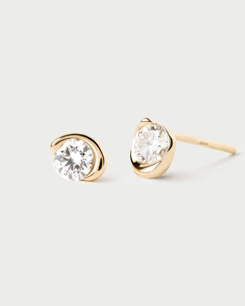 Dainty yellow gold solitary earrings with a half-bezel set lab-grown diamond