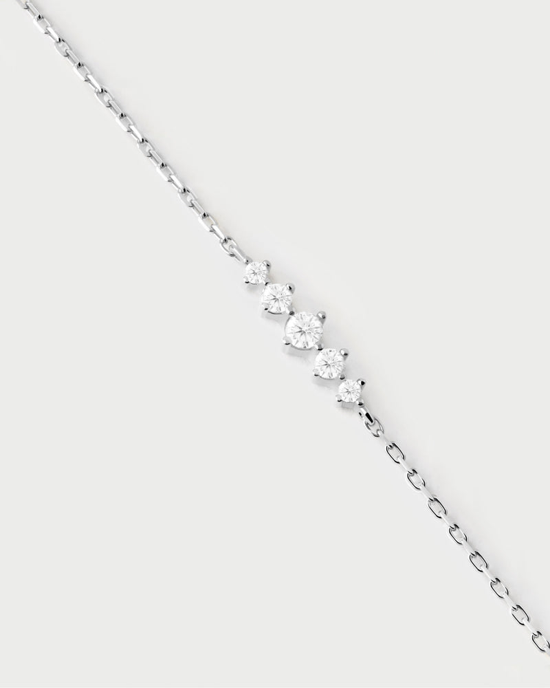 Elegant silver bracelet set with a trail of five white zirconia