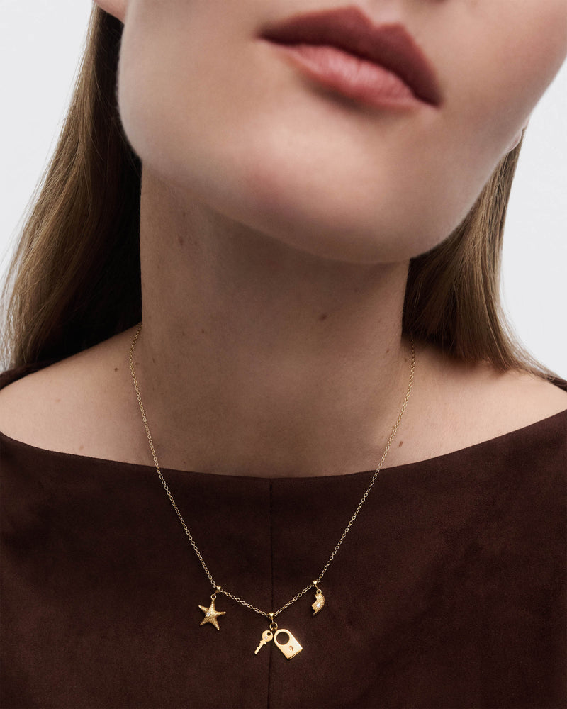 Split heart charm - 
  
    Sterling Silver / 18K Gold plating
  
