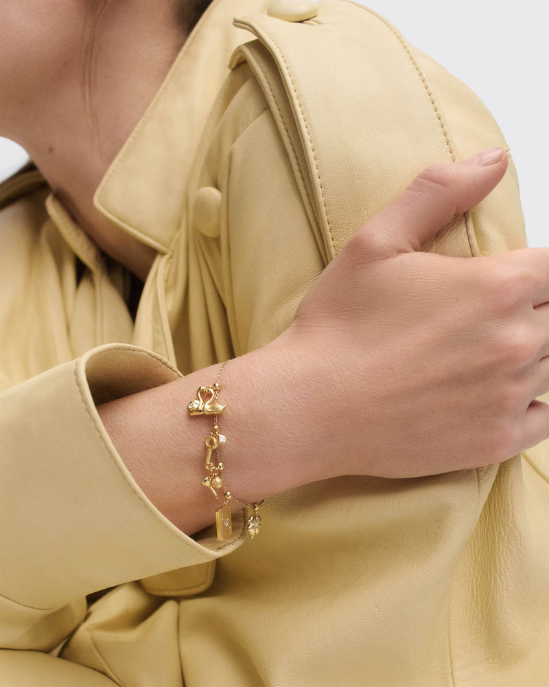 Ace of hearts charm - 
  
    Sterling Silver / 18K Gold plating
  
