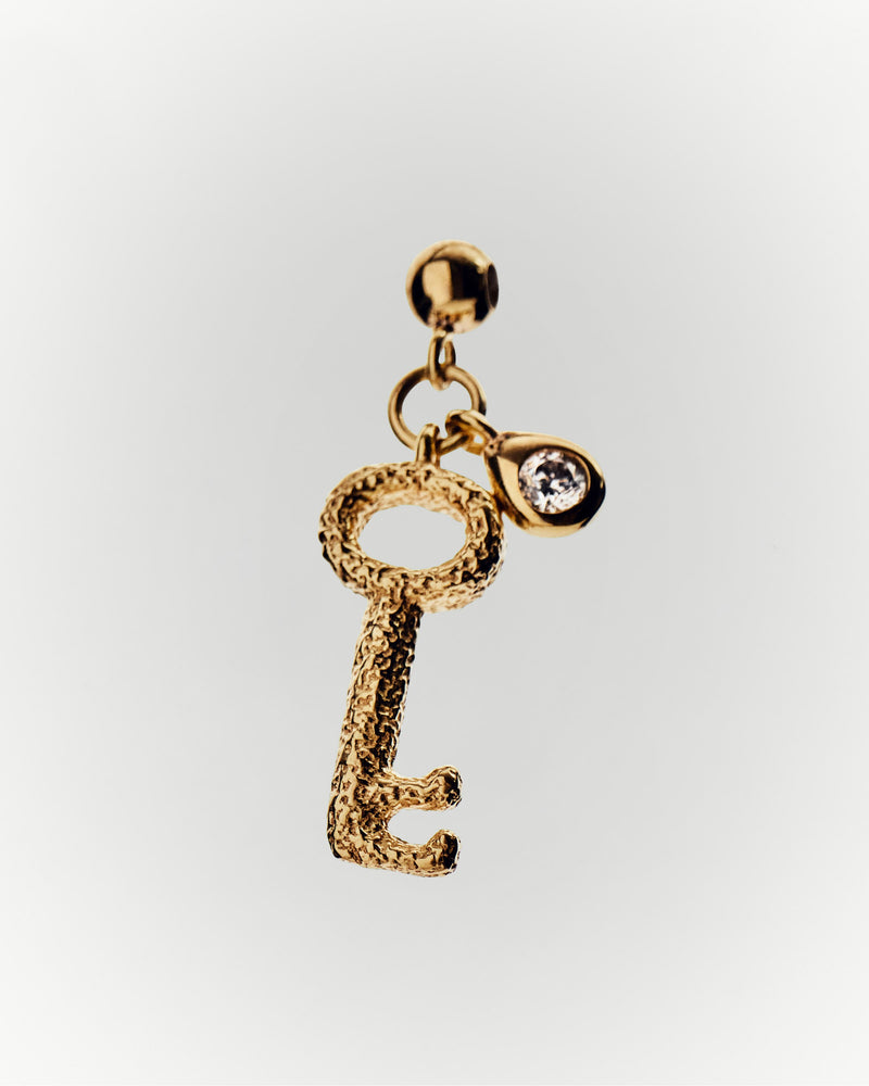 Key charm with sandblast texture and white zirconia to personalize necklace or bracelet