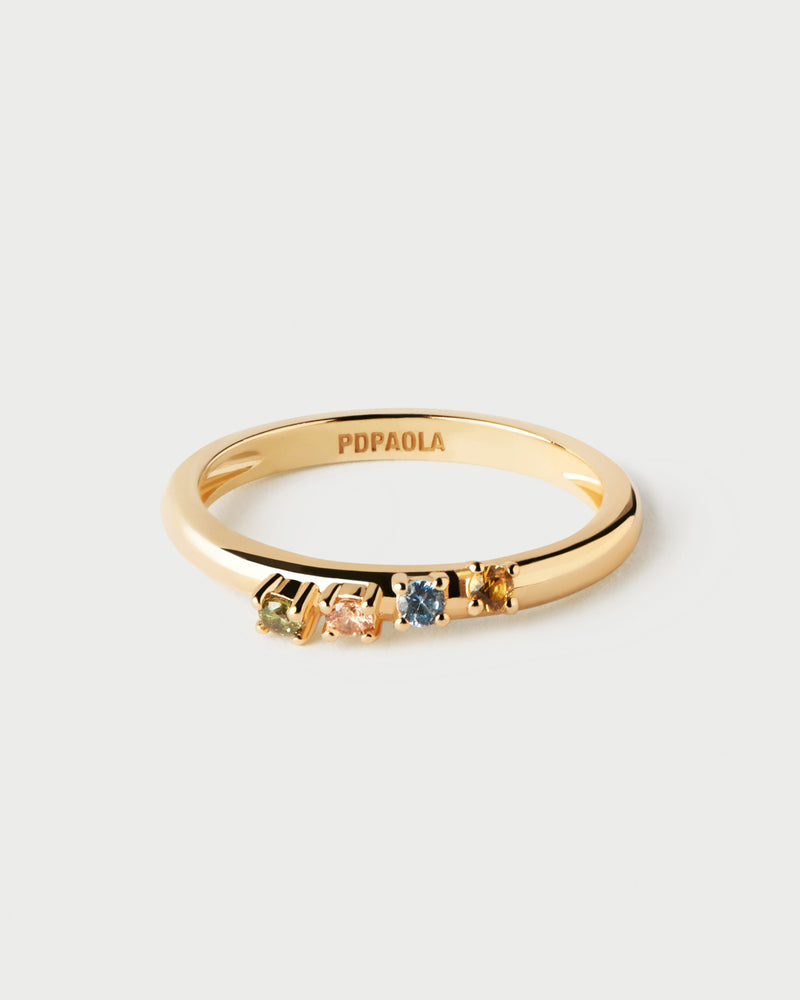 Gold-plated ring topped with a wavy set of multicolor cubic zirconias