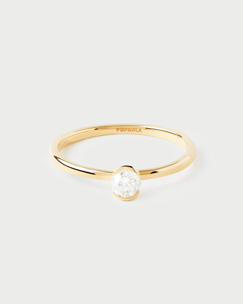 Gold solitary ring with a round half-bezel lab-grown diamond