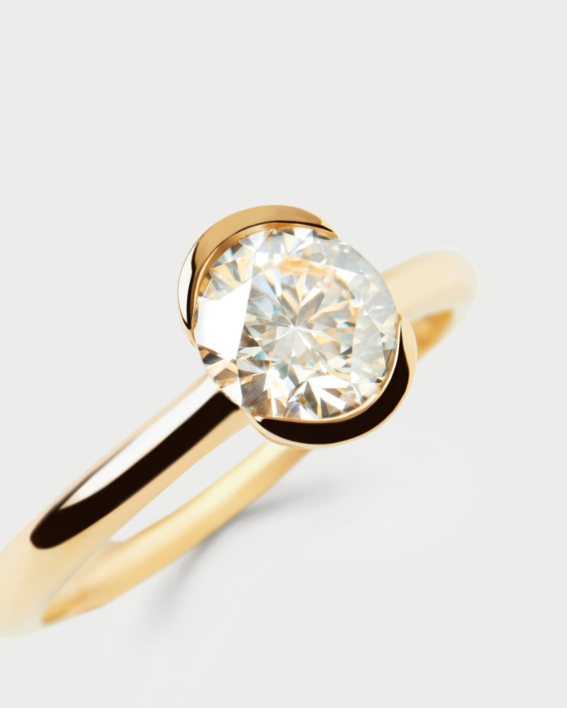 Gold solitary ring with a large round half-bezel lab-grown diamond