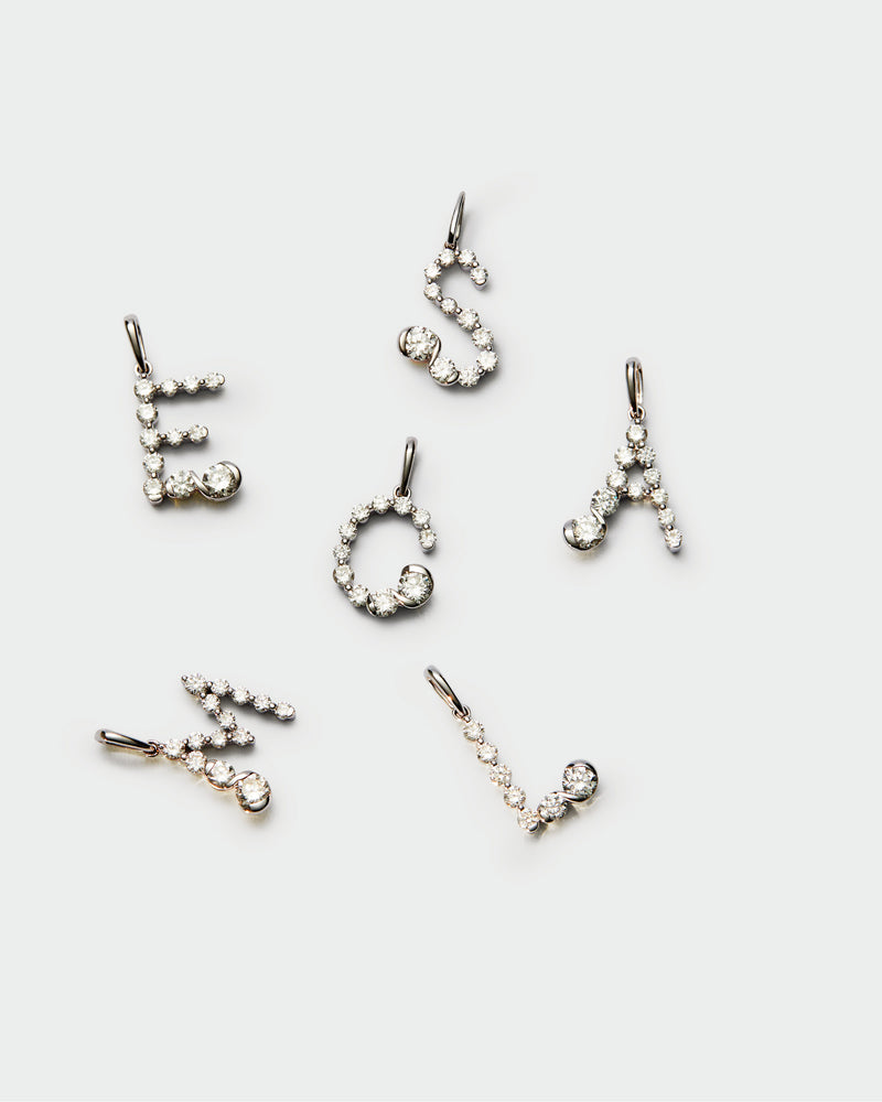Diamonds and white gold M initial pendant - 
  
    18K White gold / Rhodium silver plating
  
