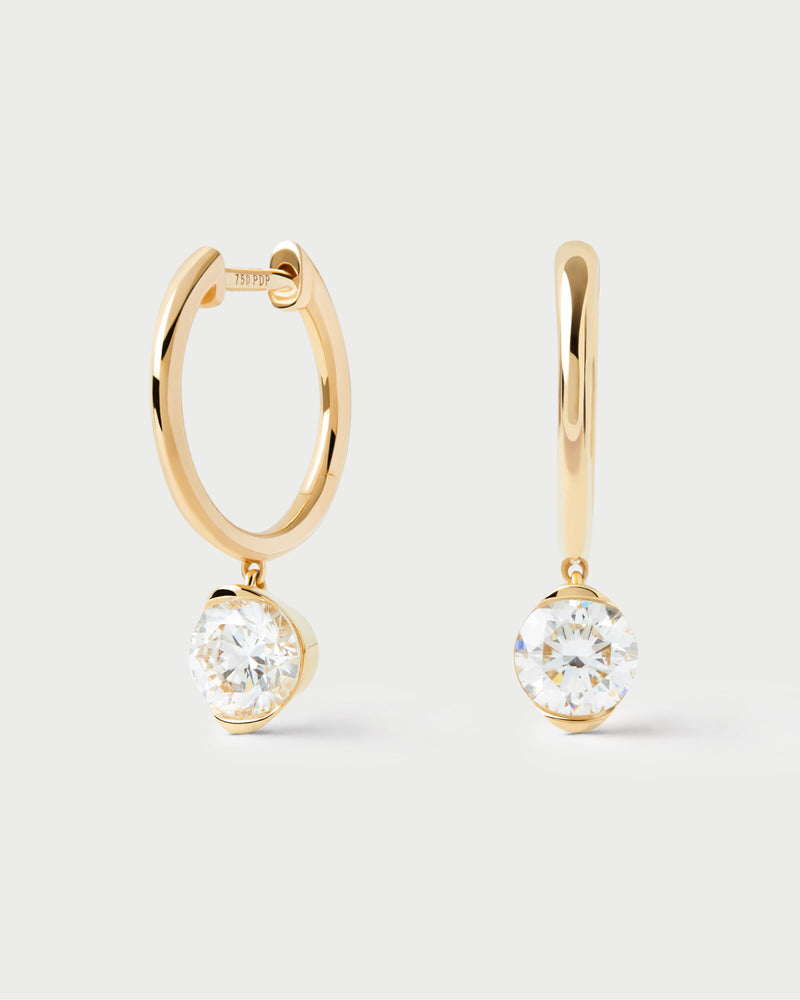 Gold hoop earrings with large round lab-grown diamond pendant