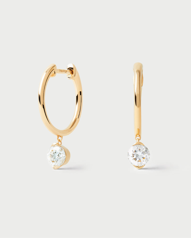 Gold hoop earrings with round lab-grown diamond pendant