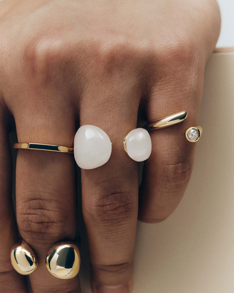 Gold-plated sculptural open ring embellished with two organic white gemstones
