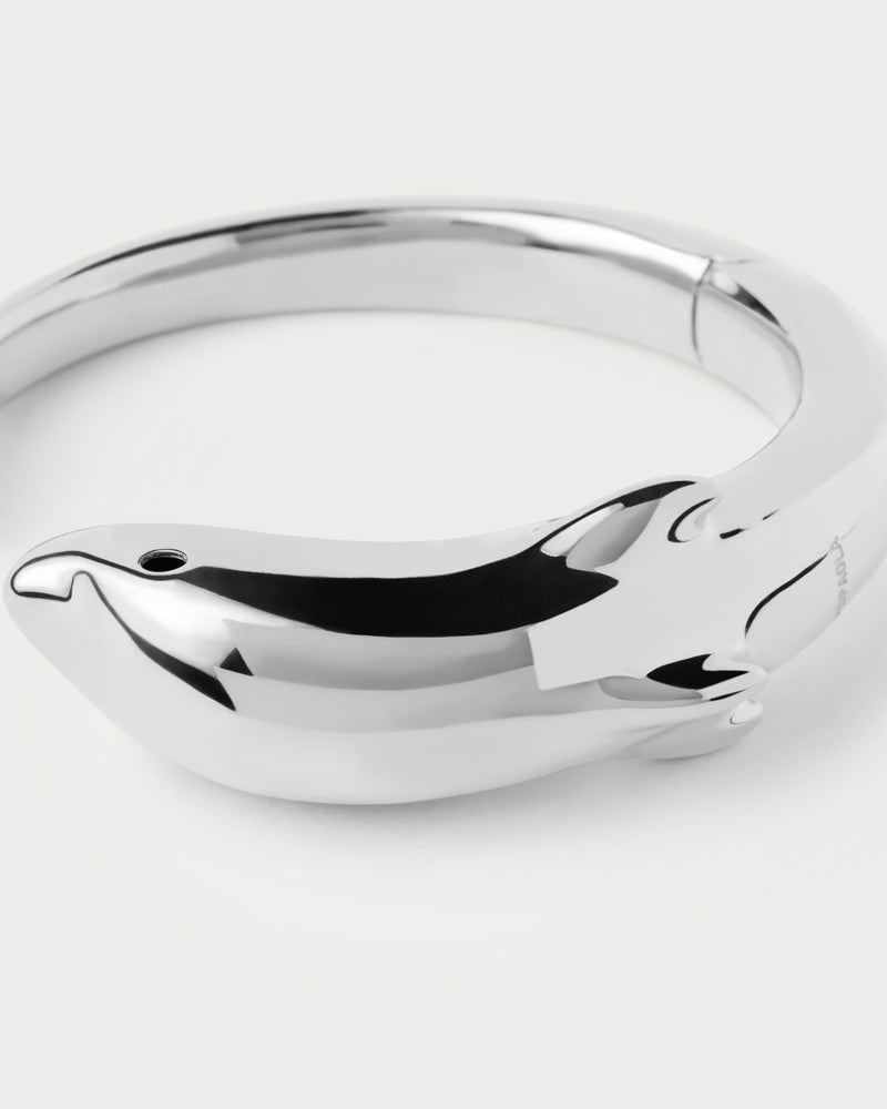 Silver modern dolphin bangle bracelet with a sculptural shape