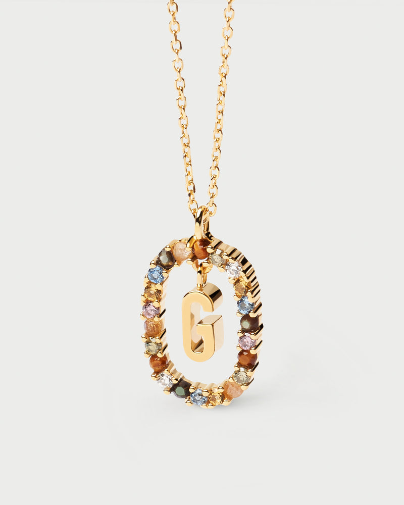 Initial G necklace in gold-plated silver, circled by colorful gemstones