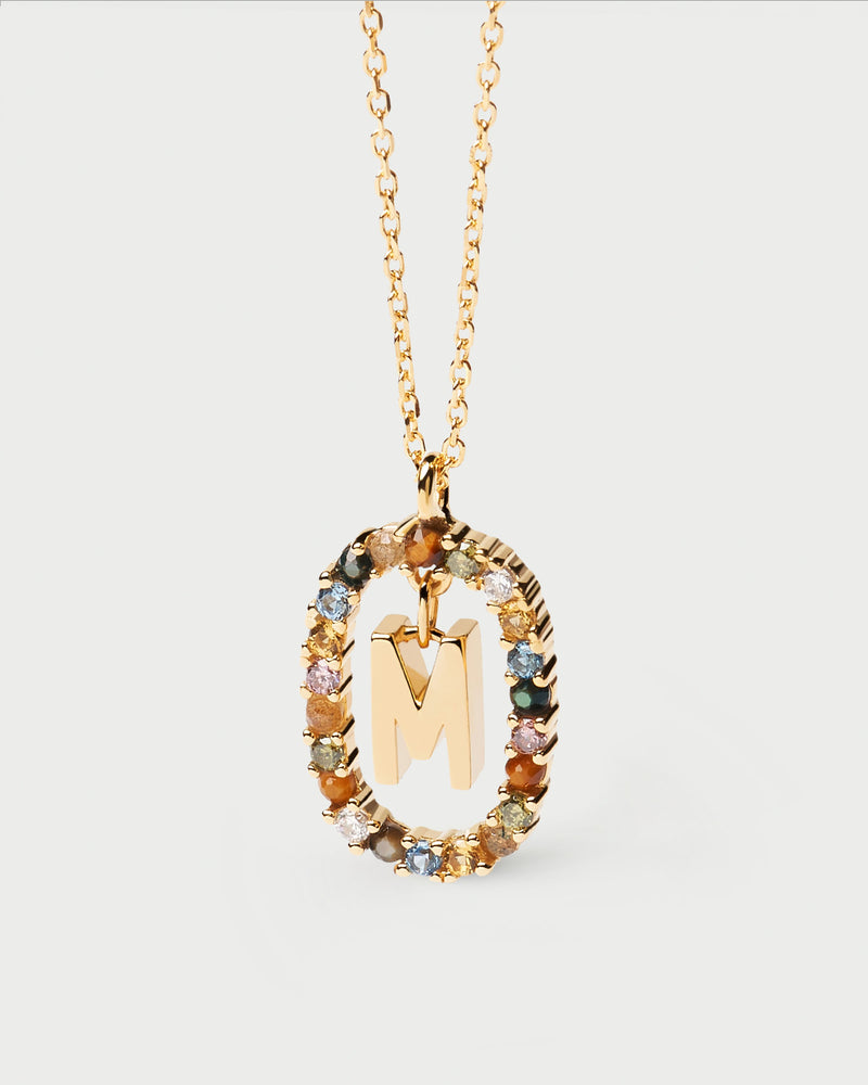 Initial M necklace in gold-plated silver, circled by colorful gemstones