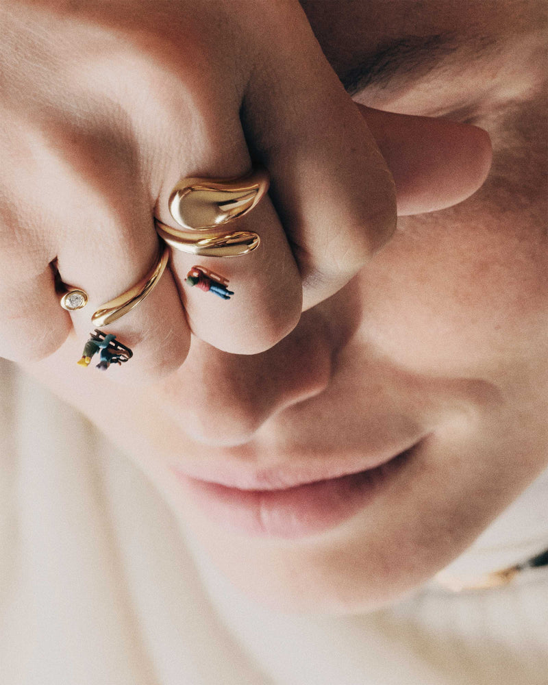 Gold-plated sculptural bypass ring with an eloganted drop shape