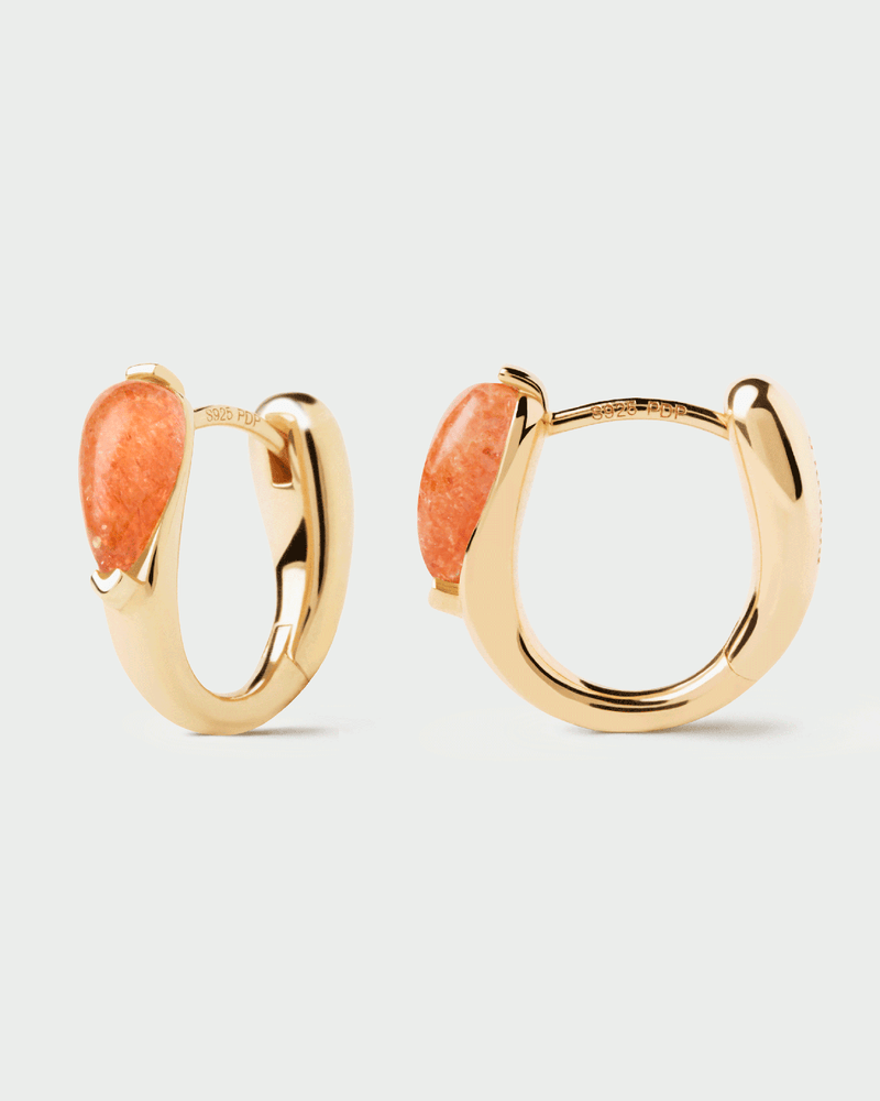 Gold-plated dainty huggie earrings accented with an oval orange gemstone