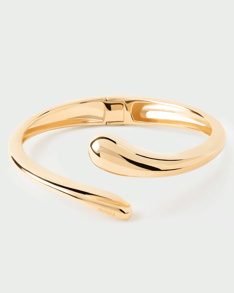 Gold-plated open bangle bracelet with a sculptural drop design