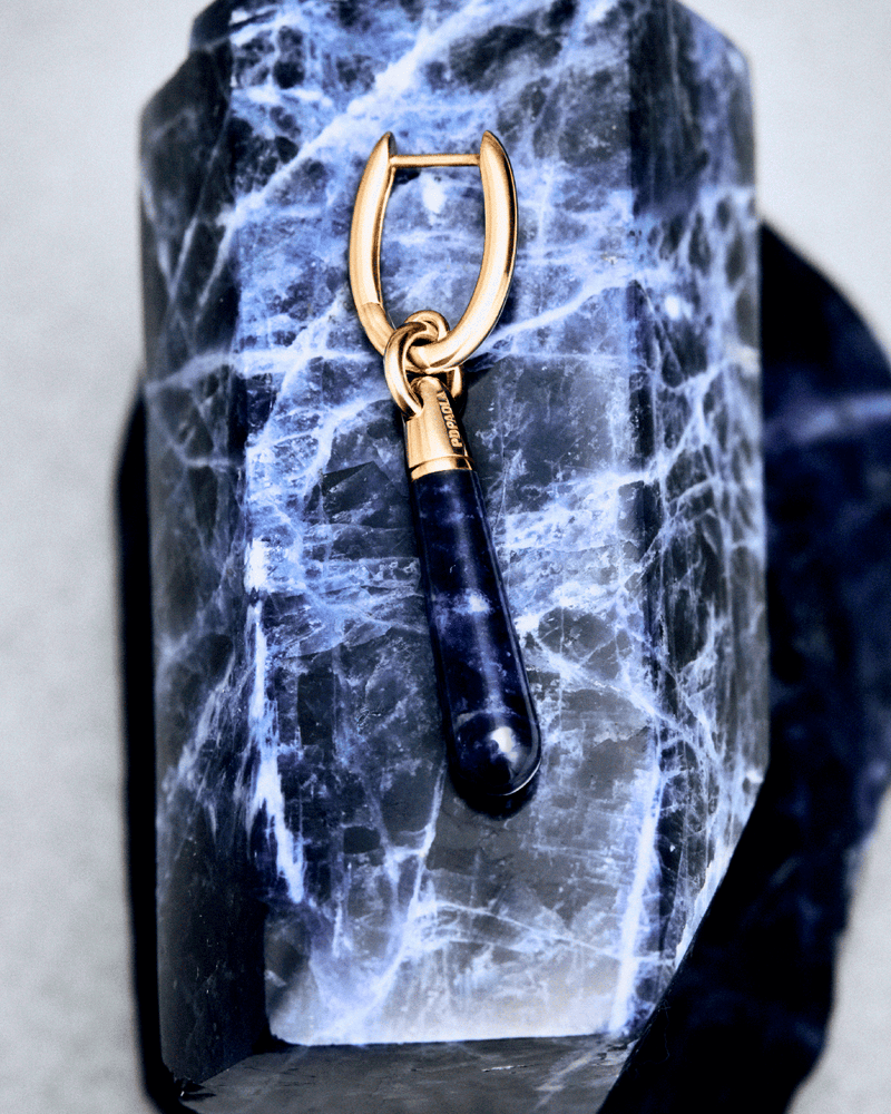 Gold-plated single hoop with a royal blue gemstone drop pendant