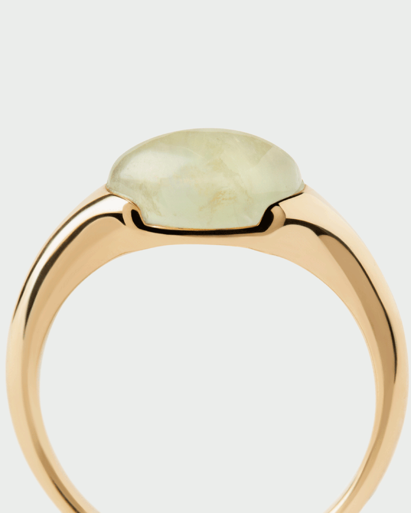 Gold-plated dainty stamp ring embellished with a green oval gemstone